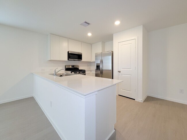 Photo - This lovely single-level home showcases a spacious open floorplan shared between the kitchen, din...