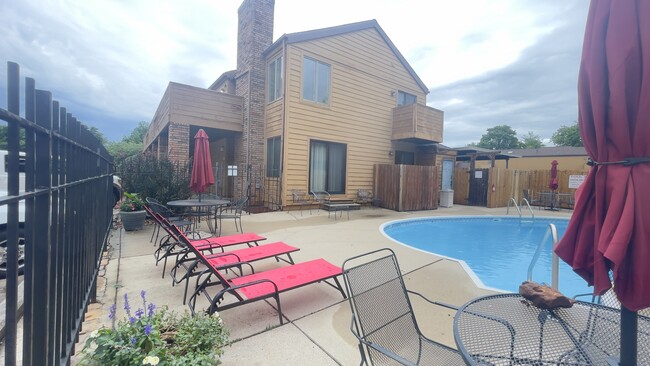 Looking at the Top Floor Condo from Pool - 3440 S Delaware Ave Unit 102