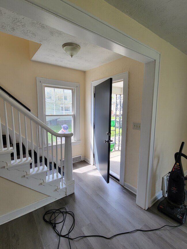 Front door and steps upstairs