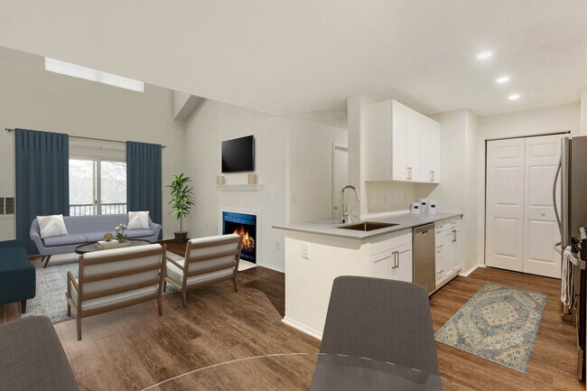 Renovated Package I kitchen, dining, and living areas with hard surface plank flooring