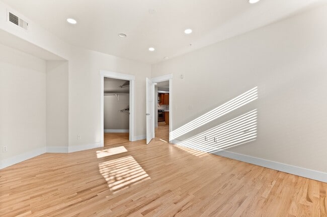 large primary bedroom with walk in closet - 1080 E 13th Ave Unit 301