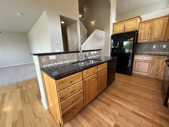 Photo - $500 Off First Month Of Rent! Modern 3BR Townhome with Fenced Yard & Garage