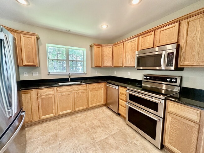 Photo - Four Bedroom Home with Private Fenced Back Yard in the Farm!