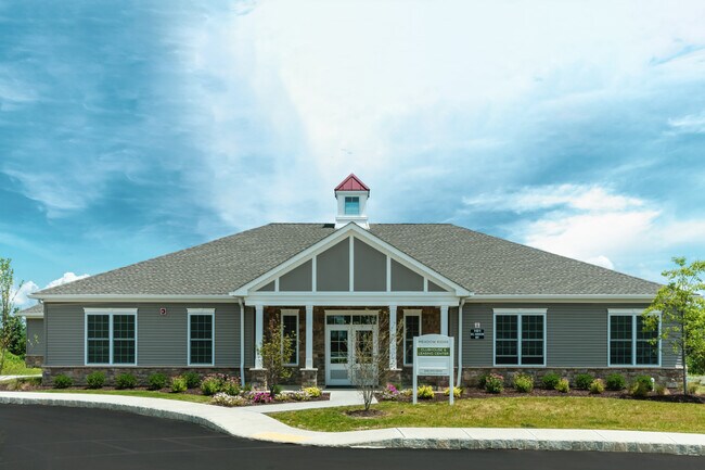 Our clubhouse is the perfect place to relax and socialize, featuring a kitchen area, a welcoming fireplace, a comfortable lounge space, and more!