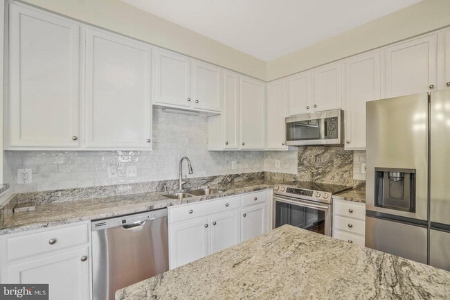 Photo - This beautifully maintained brick-front, three-level townhome is located in a highly sought-after...