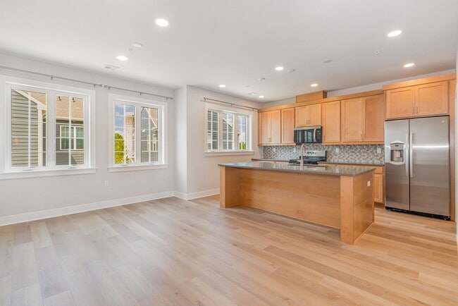 Photo - Modern 2025 Townhome | Open-Concept Living, Chef’s Kitchen with Large Island & 2-Car Garage