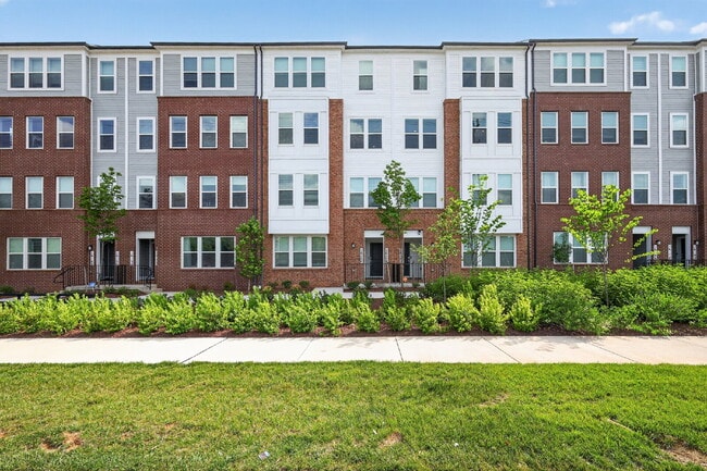 Photo - Stunning 2-Level Top Floor Condo with Tesla Charger & 70" TV – Farmstead District