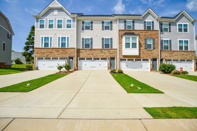 Building Photo - 3 Bedrooms | 2.5 Bathrooms | Lower-Level Flex Room | Approximately 1,978 Square Feet | 2-Car Gara...