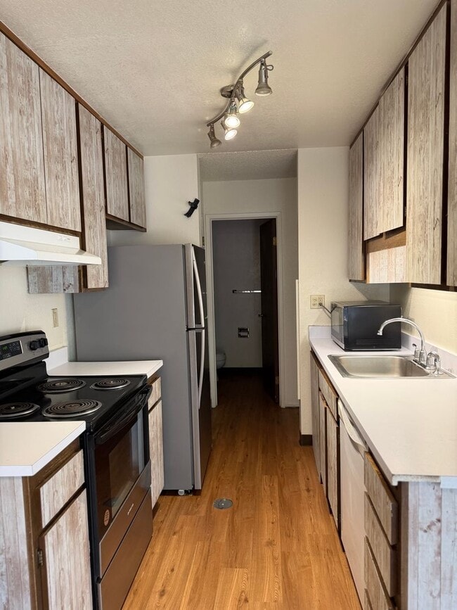 Photo - Spacious 2 Bed, 1.5 Bath Condo w/Carport - Outdoor Pool in Summer (Long Term Rental)