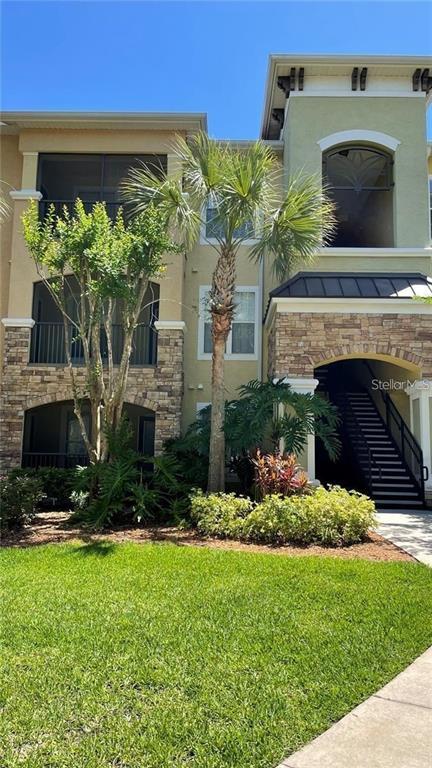 Building Photo - 10019 Courtney Palms Blvd Unit 303