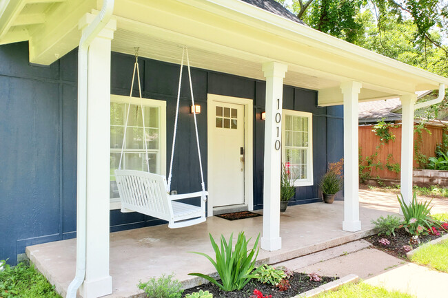 Front porch with swing - 1010 W Chestnut St House