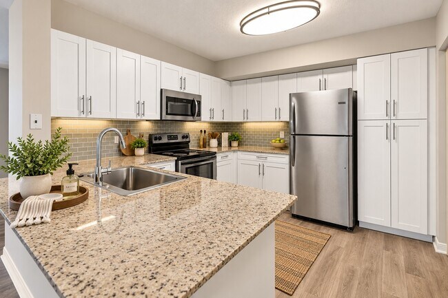 Elevate your lifestyle at Manatee Bay with this stunning kitchen featuring high-end finishes, ample counter space, and modern appliances. Ideal for culinary enthusiasts and entertainers alike. Schedule a tour today and see for yourself!