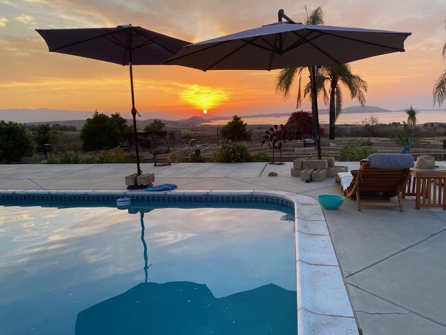 backyard view with beautiful sunsets - 15691 Wendell Park Dr Casa