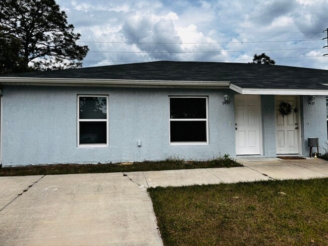 Building Photo - 9437 N Travis Dr