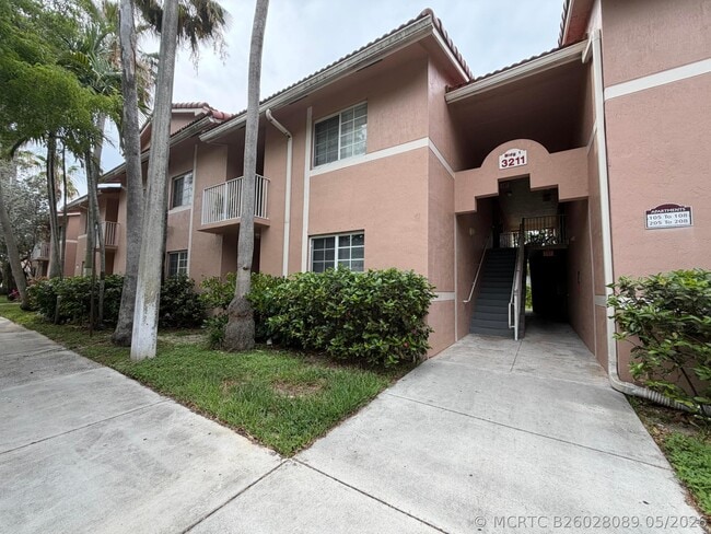 Building Photo - 3211 Sabal Palm Manor Unit 105