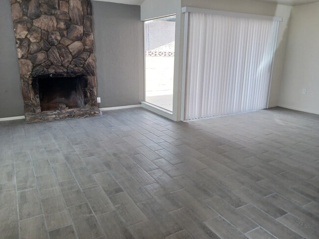 Living room with a fireplace - 1230 N Las Posas Ct