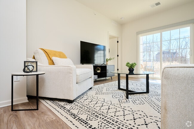 Plano A - 2 BR, 2 BA - 1100 SF. Sala de estar. - Genesee Pointe Apartments