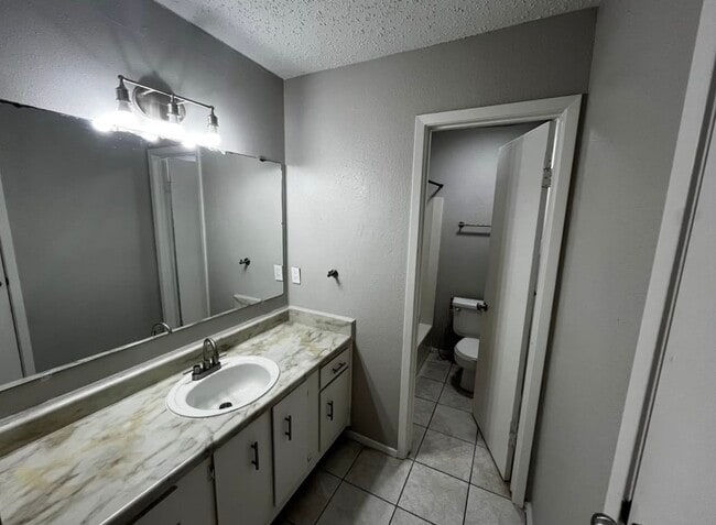 Building Photo - 12118 W Bellfort Ave Unit C