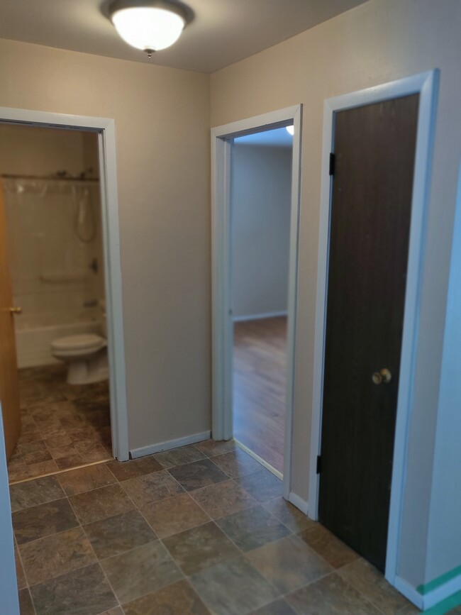 Open hallway to bathroom, bedrooms and linen closet. - 3348 brown st Townhome