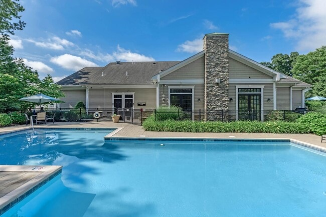 TAKE A DIP IN OUR SHIMMERING POOL - Vintage at the Grove Apartments