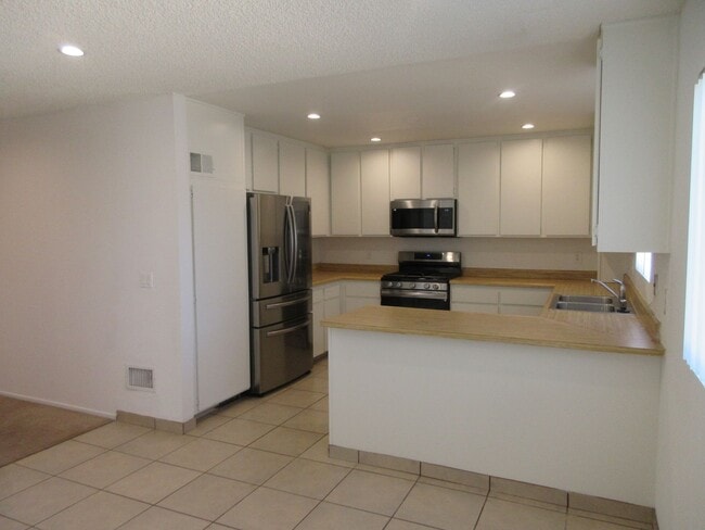 Photo - Duggan Property Management, Inc presents  *Reduced*  Canoga Park- 3BD 2.5BA