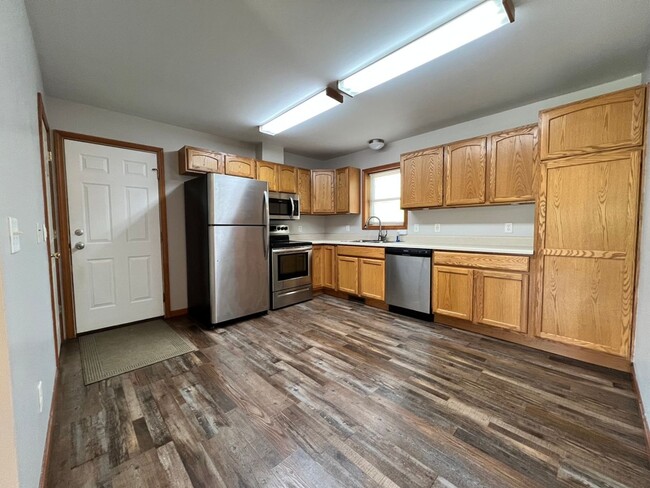 Photo - Spacious 3BR Duplex with Finished Basement & 2-Car Garage in Otsego Unit 1389