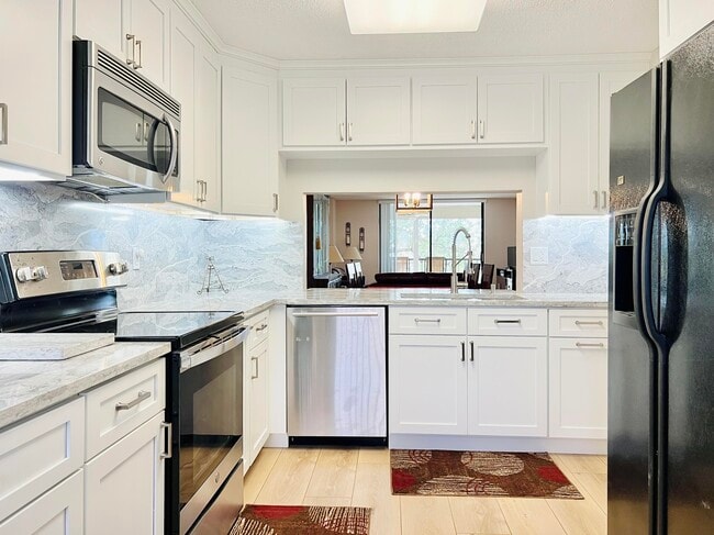 Building Photo - 4725 Lucerne Lakes Blvd E Unit 311