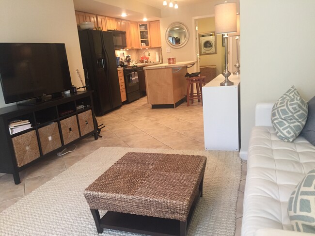 Living Room and Kitchen - shown furnished - 114 12th St NE Apartments Unit Big Bright English Bsmt