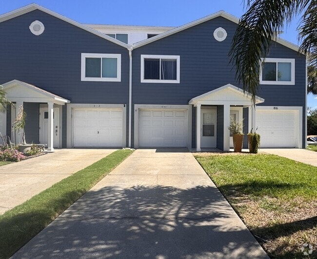 Building Photo - Coastal Luxury Awaits – 3-Story Townhome i...