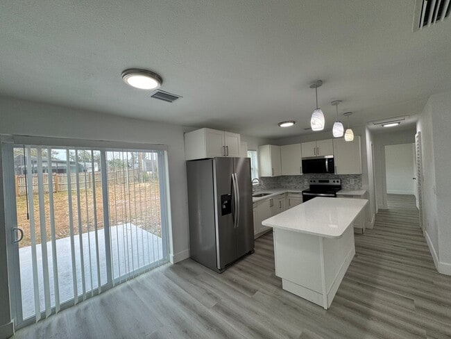 Photo - Recently Renovated 4/2 Home with Open Layout & Huge Backyard