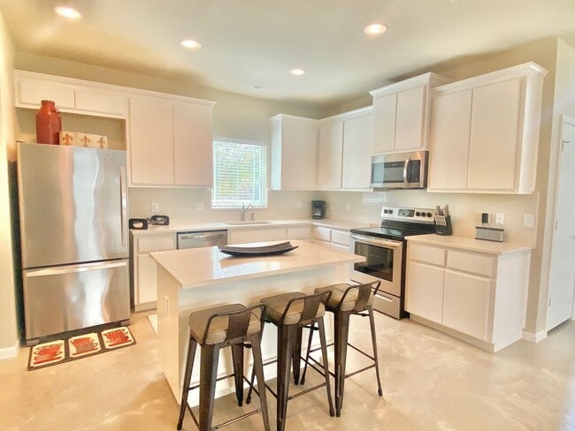 Photo - This charming two-story home, built in 2018, offers a spacious open floor plan perfect for casual...