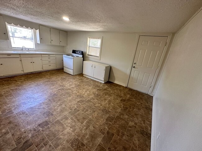 Photo - Charming 3 Bedroom House with Fenced Backyard | Conveniently Located near 820 and W. Camp Bowie