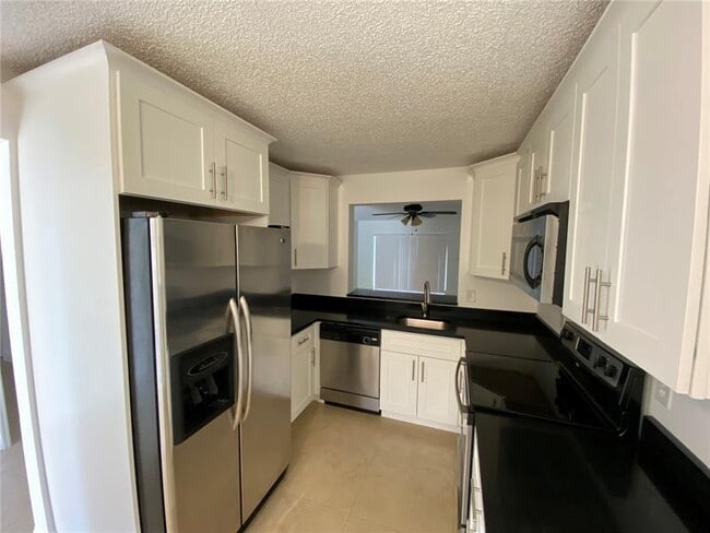 Building Photo - 23466 Lyons Rd Unit 504