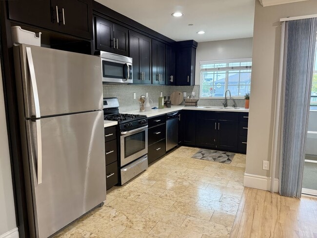 Photo - MOVE IN READY 2/2 with 2 Assigned Parking! In Unit Washer & Dryer! Gated Community! Centrally Loc... Unit 4