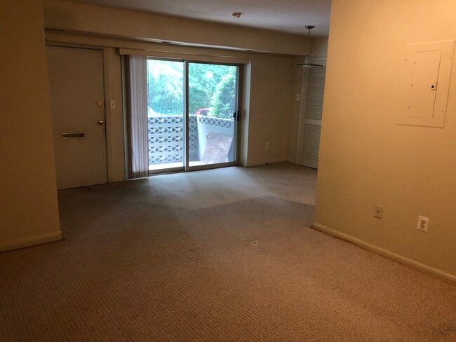 Living room looking into dining room/ patio - 8708 Manchester Rd Unit A