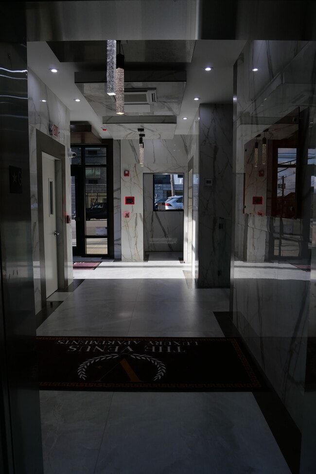 Hallway to Mail Room - Venus Apartments
