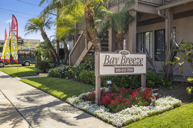 Outdoor signage at Bay Breeze Apartments in Costa Mesa, CA