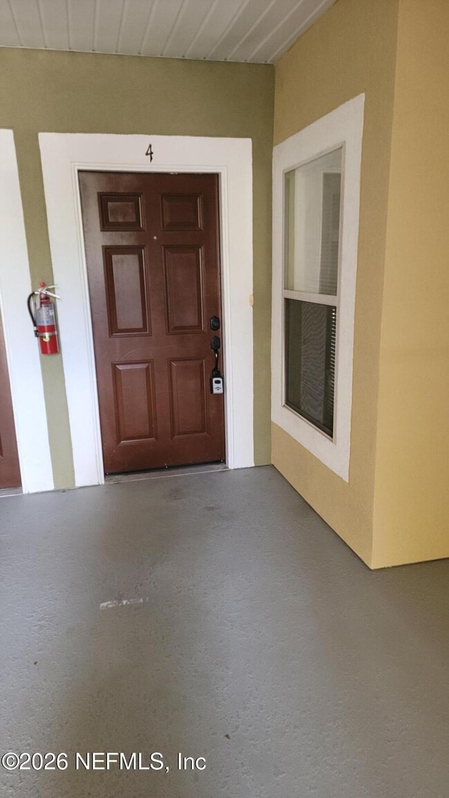 Building Photo - 6984 Ortega Woods Dr Unit 8-4