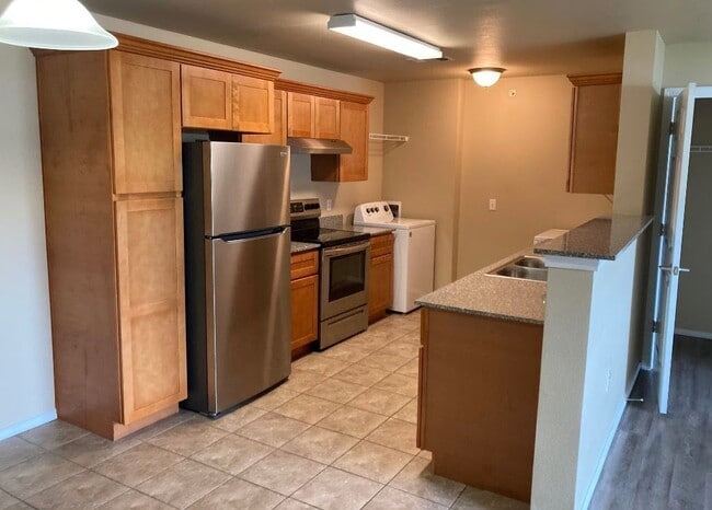 Step into the modern kitchen at Bee Creek, where contemporary design meets functionality. Enjoy sleek stainless steel appliances, ample counter space, and a bright, open layout perfect for culinary creations. Schedule your tour today! - Bee Creek