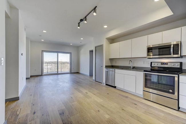 living room with balcony from the entrance - 400 Herron Dr Unit 118
