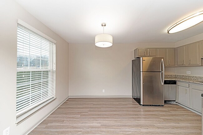 Dining area with hardwood-style flooring