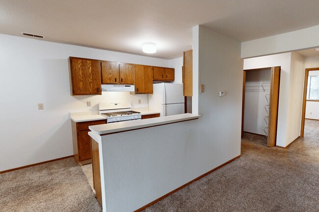 Kitchen with Breakfast Bar In Select Homes