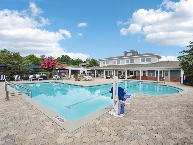 Resort-style swimming pool and outdoor amenity spaces at Village at Broadstone Station in Apex, North Carolina