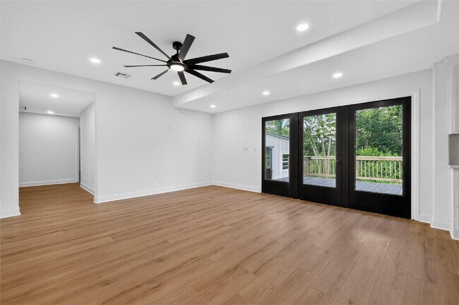 "Fully Remodeled 4-Bedroom Luxury Home Backing to a Greenbelt with Two Primary Suites!"