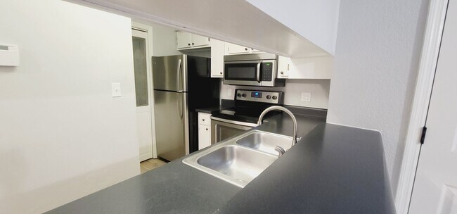 Photo - MODERN NW 3/2 w/ Washer/Dryer, Plank Vinyl Floors, Deck, & Vaulted Ceilings! Available NOW for $1...