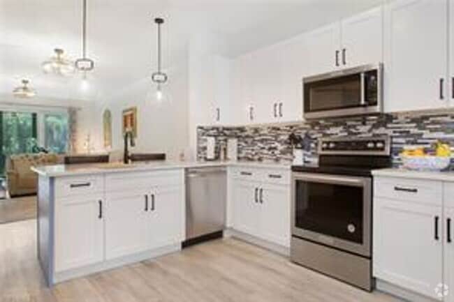 Building Photo - ANNUAL RENTAL - FURNISHED 3 BED / 2 BED CO...