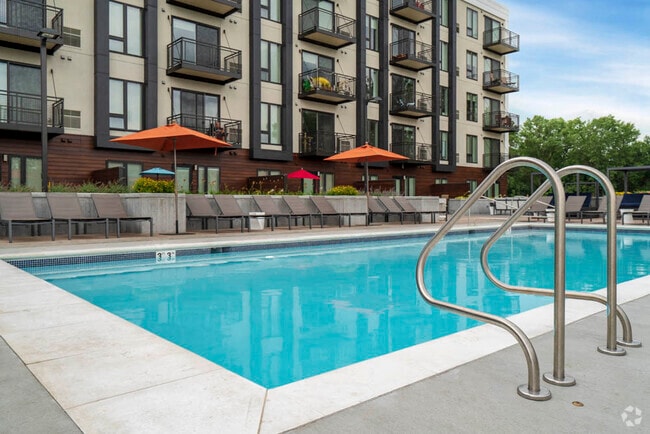 Our resort-style pool offers the perfect spot to unwind, soak up the sun, and enjoy a refreshing swim on warm days. - The Preserve at Normandale Lake Rental