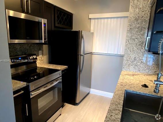 Building Photo - 2850 N Oakland Forest Dr Unit 204 Rental