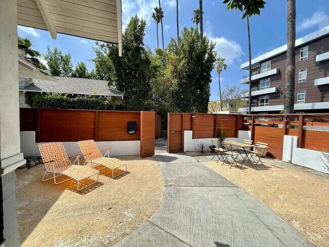 Sunny outdoor space with lounge area and seating. Rare privacy in the heart of Hollywood. - 6000 Carlton Way