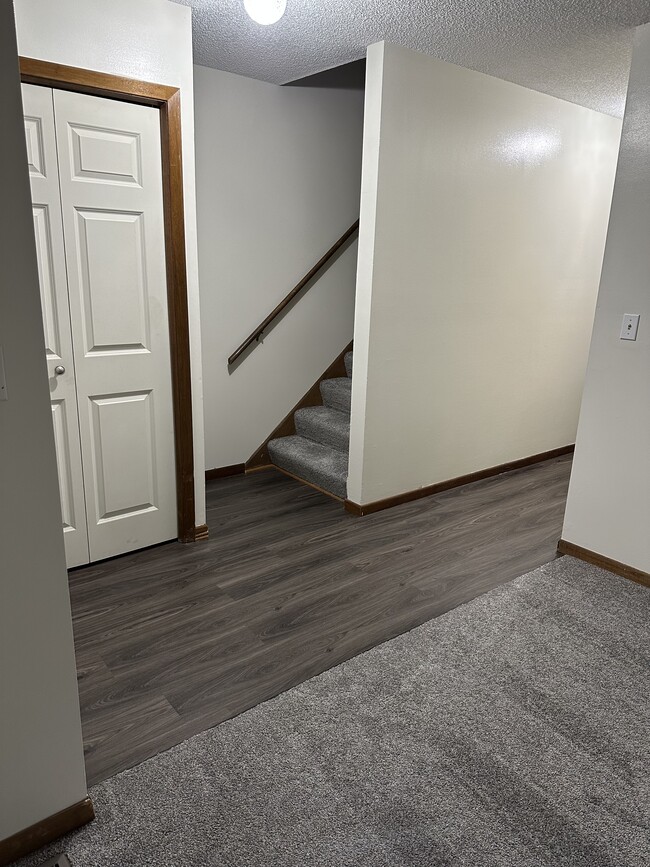 Front door closet and stairs - 701 Tyler St NE Townhome